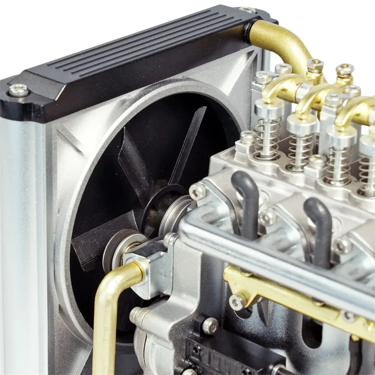 Close-up of TECHING L4 diesel engine model cooling system featuring anodized aluminum components.