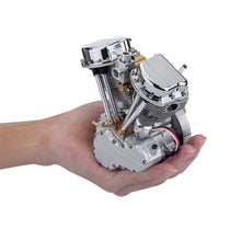 CISON working V-twin model engine shown handheld for size comparison and scale.
