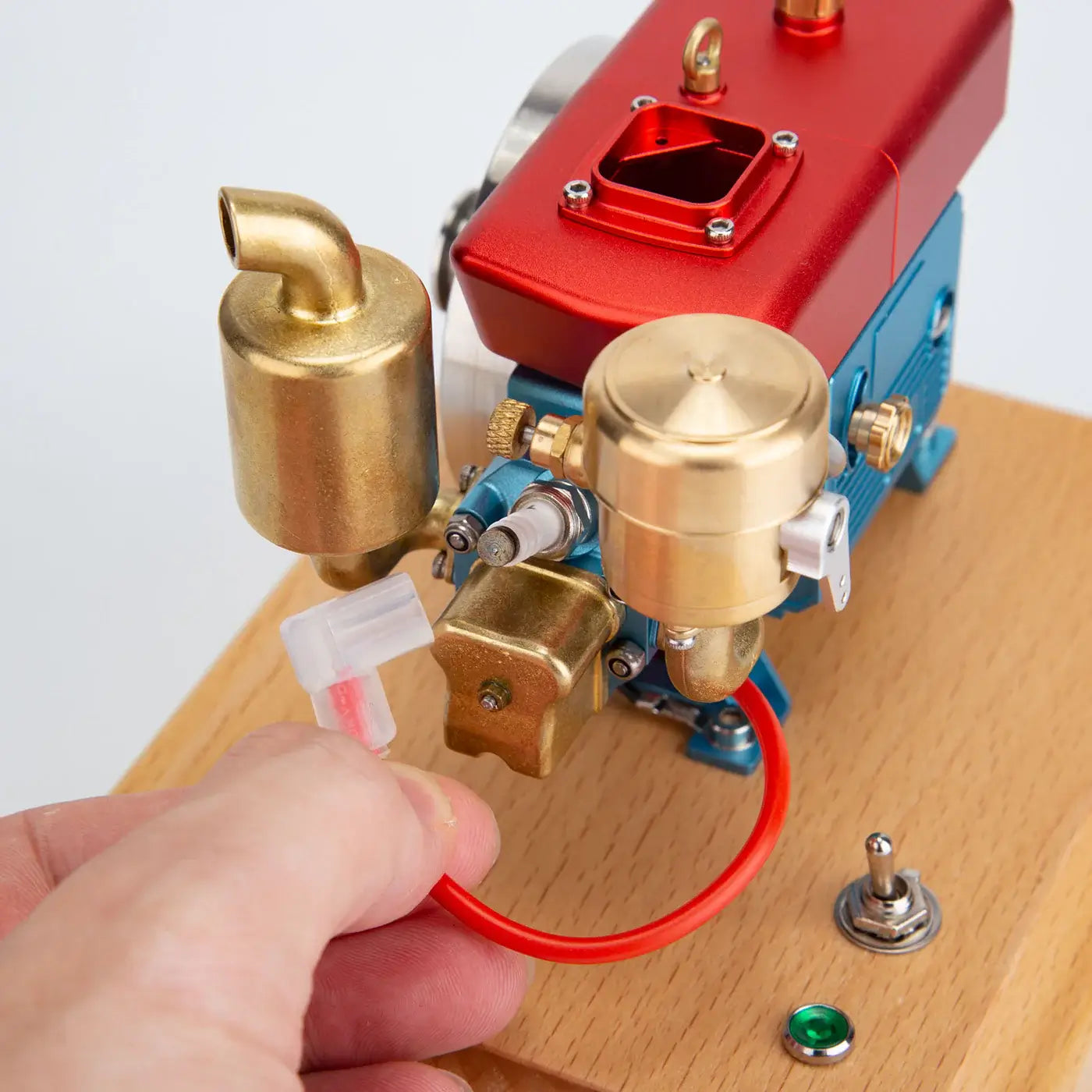 Close-up of MUSA 2.2cc working small single-cylinder engine kit designed for realistic performance and display.