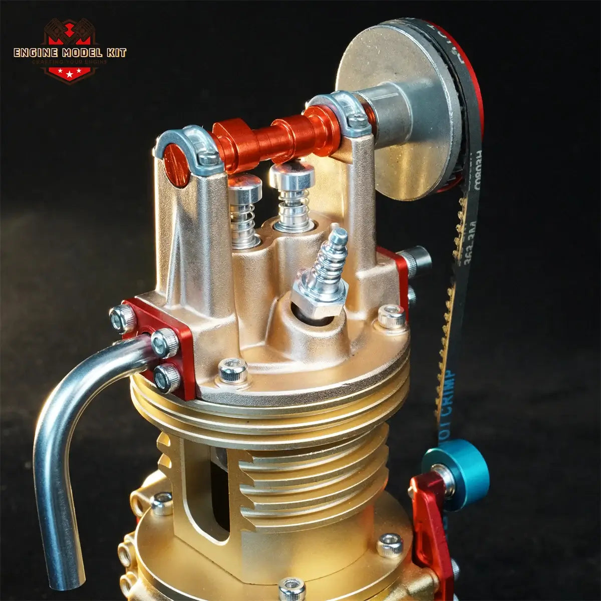 Close-up of a single-cylinder engine model's camshaft and spark plug detail.
